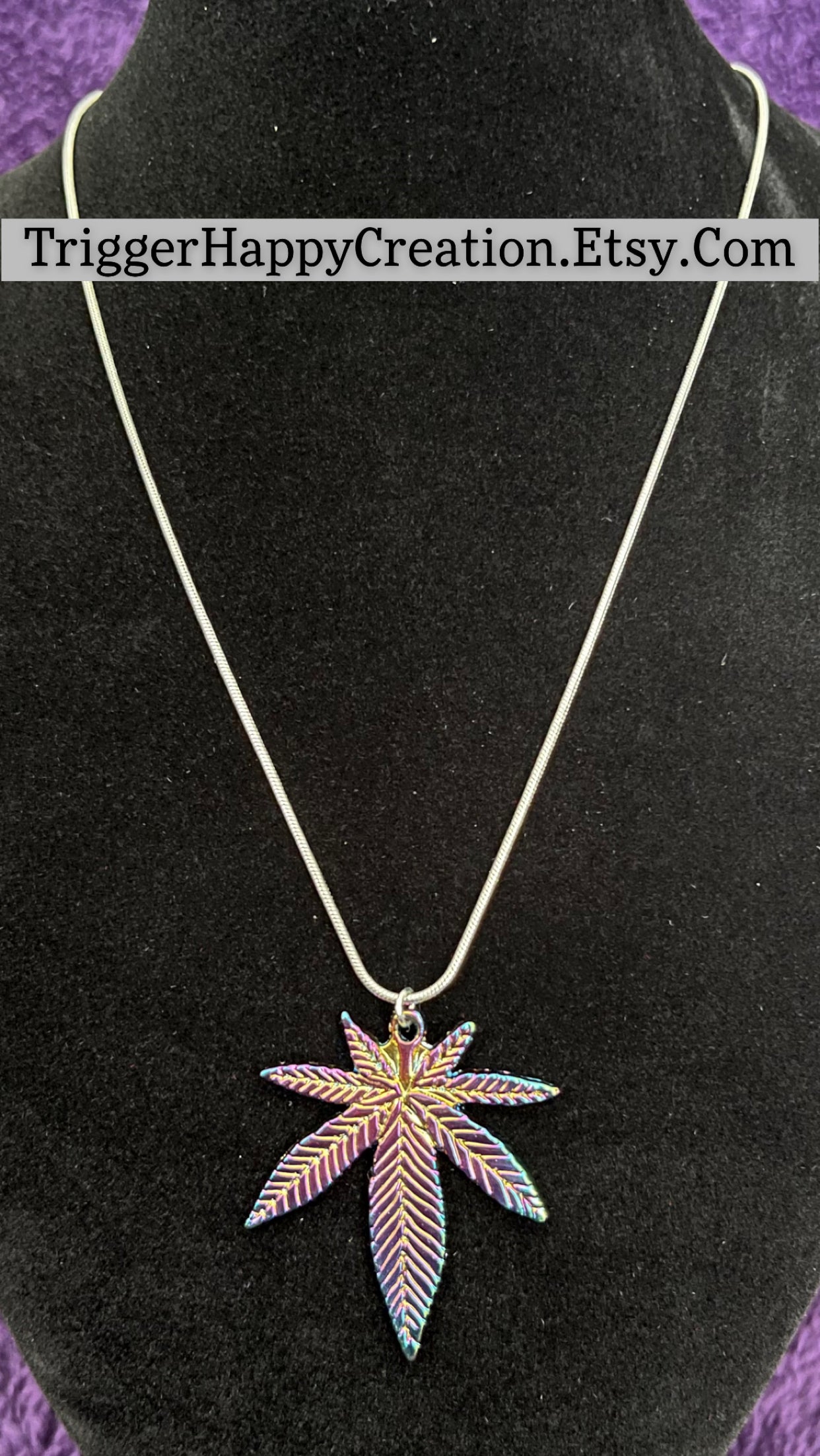 Multi colored pot leaf charm on 16” silver plated necklace